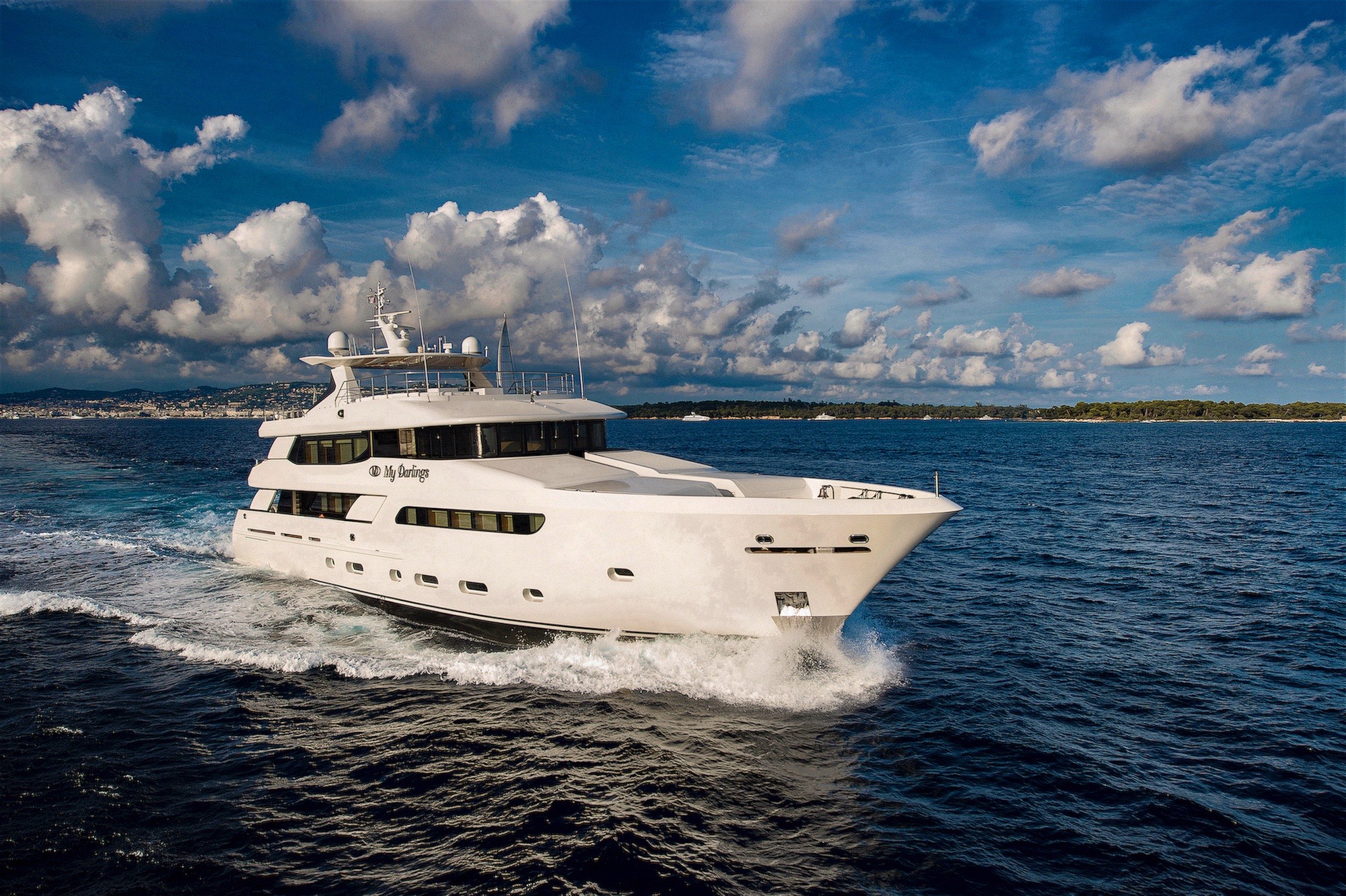 M/Y Mine Games running under scattered clouds