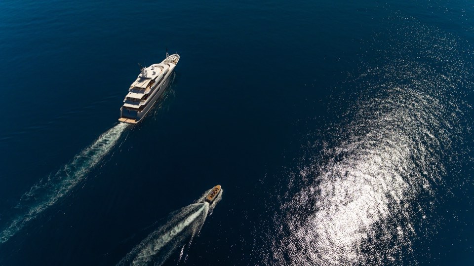 Two yachts underway seen from a drone