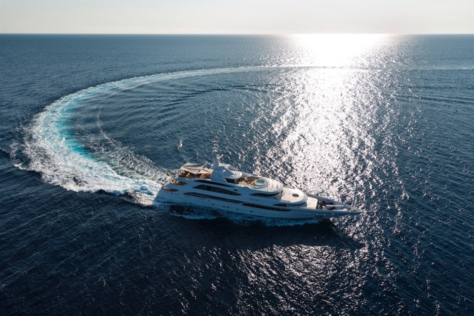 Yacht leaving a curved wake in a turn, aerial view