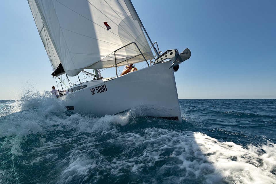 Sailing yacht pushing a bow wave in fresh breeze
